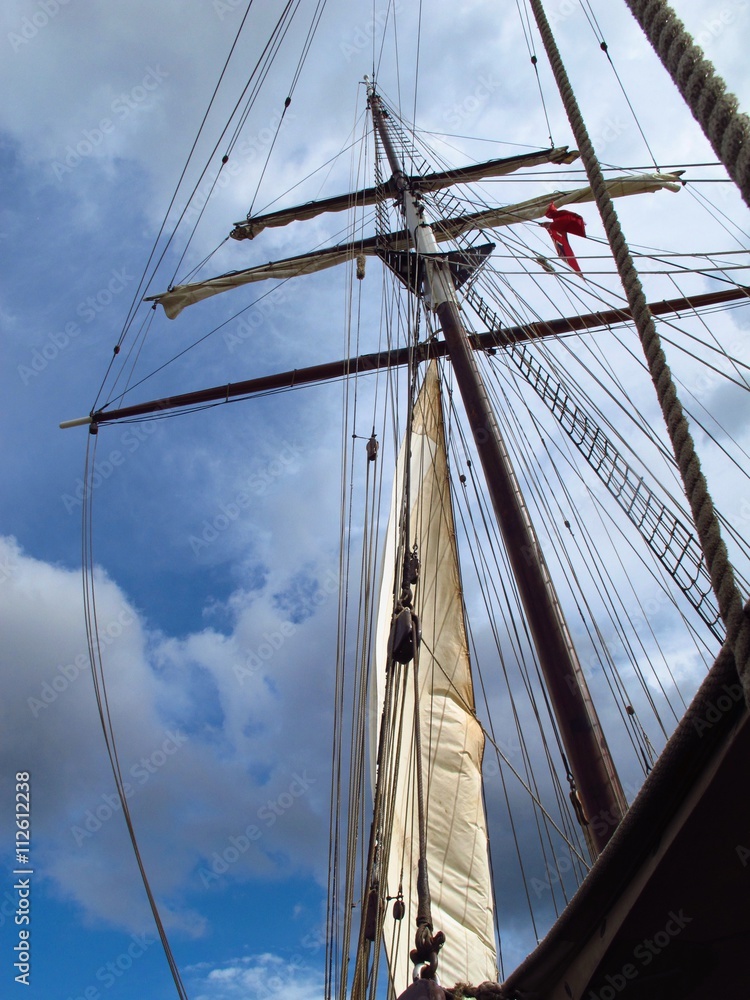Fototapeta premium ship mast silhouetted by the sky