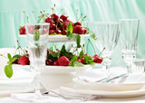 Summer. Table setting. Berries - strawberries and cherries at a