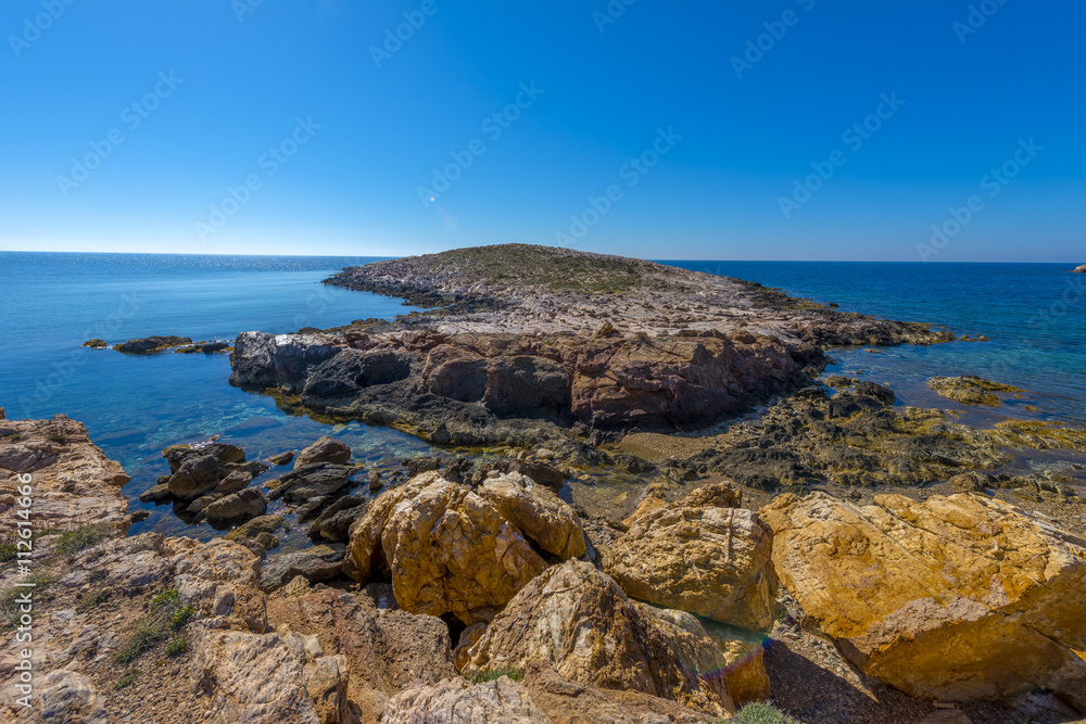 Rocky beach in Mykonos, Cyclades, Greece.