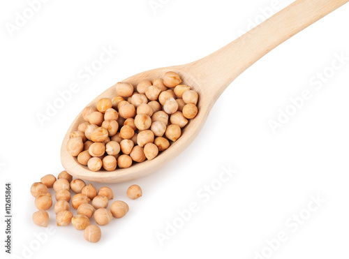 Chickpeas in wooden spoon on white background
