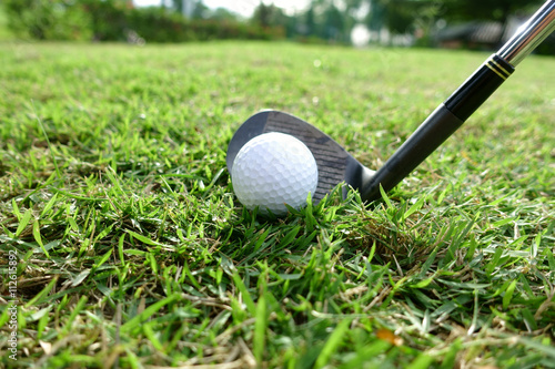 Golf balls on green grass background