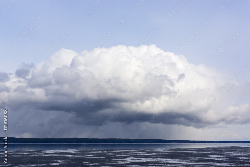 Formidable cloud over lake