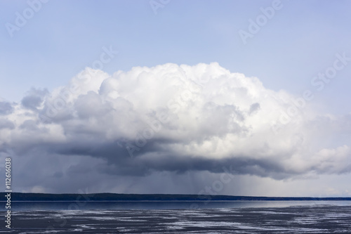 Formidable cloud over lake