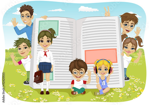 kids playing on the field next to giant book