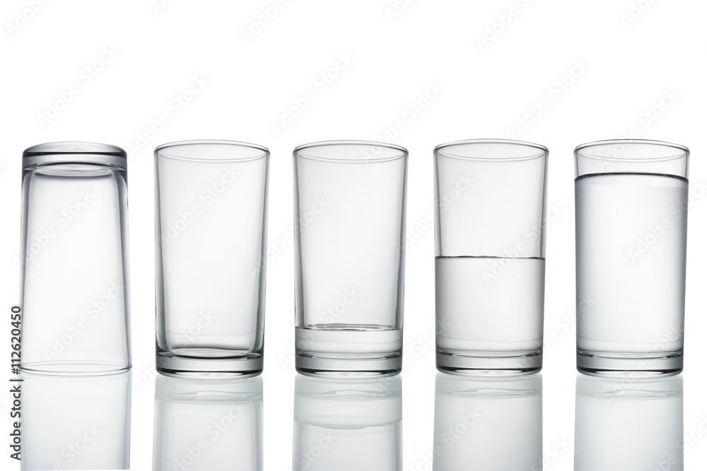 .tall empty, half and full glass of water isolated on white with .tall empty, half and full glass of water isolated on white with