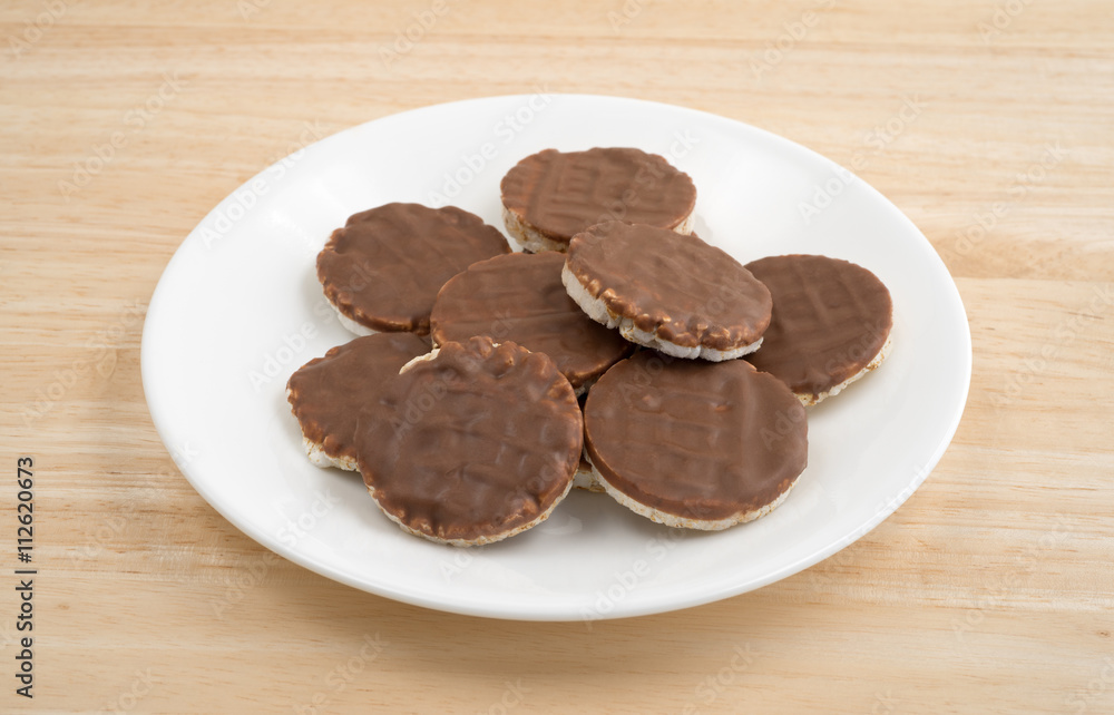 Organic rice cookies with milk chocolate icing on plate Organic rice cookies with milk chocolate icing on plate