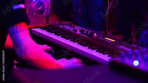 detail of piano player in the club ,no sound,real time, photo