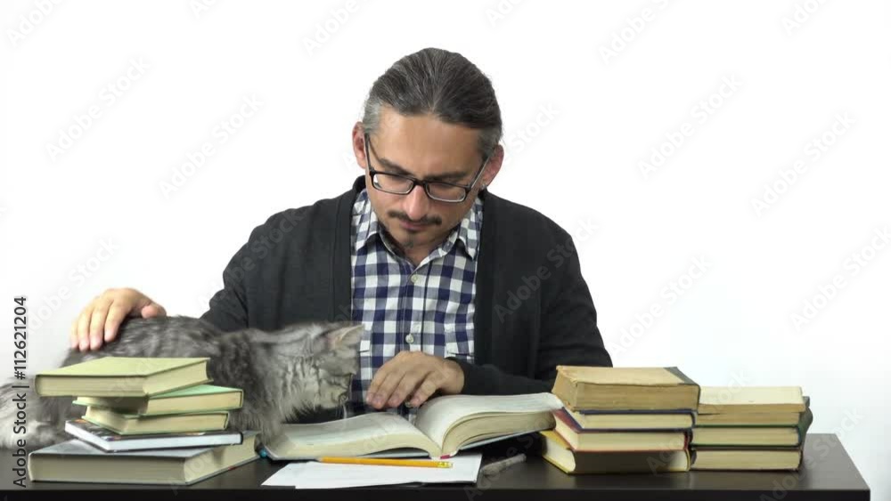 man sitting at table studying and writing in notebook. his cat is looking at him. 4k people stock footage clip at white background.
man sitting at table studying and writing in notebook. his cat is looking at him. 4k people stock footage clip at white background.