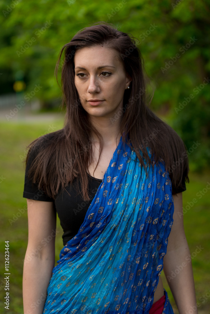 Pretty brunette woman wearing indian dress and scarf Pretty brunette woman wearing indian dress and scarf