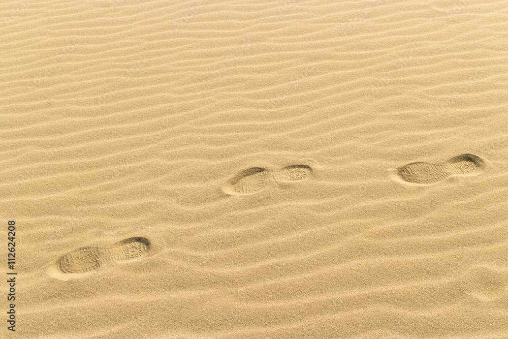 footprints on the yellow sand of the desert, sand dunes footprints on the yellow sand of the desert, sand dunes