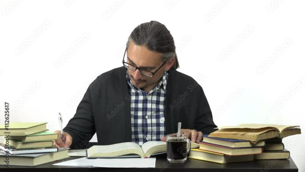 man sitting at table studying and stirring coffee. 4k people stock footage clip at white background.
man sitting at table studying and stirring coffee. 4k people stock footage clip at white background.
