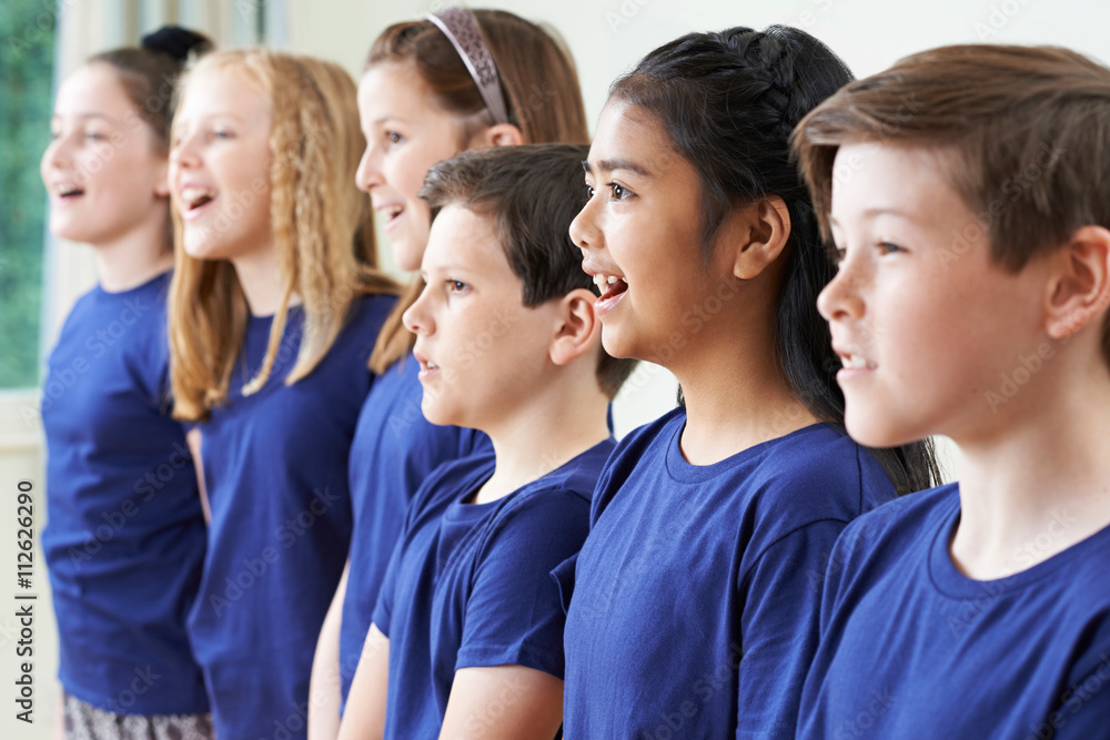 Group Of School Children Singing In Choir Together Group Of School Children Singing In Choir Together