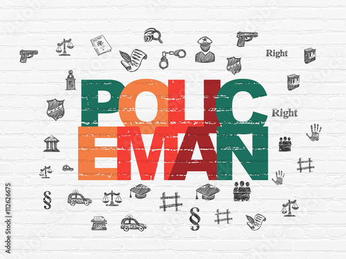 Law concept  Policeman on wall background