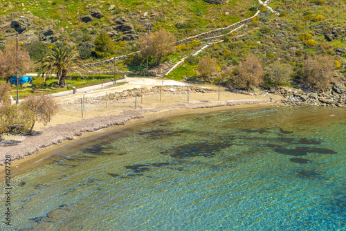 Fototapeta Naklejka Na Ścianę i Meble -  Beautiful sandy beach in Syros, Cyclades, Greece. Crystal clear