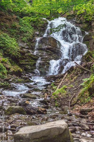 Waterfall in Carpathian mountains. Lower waterfall cascade in forest