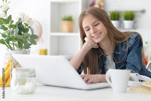 happy girl using laptop