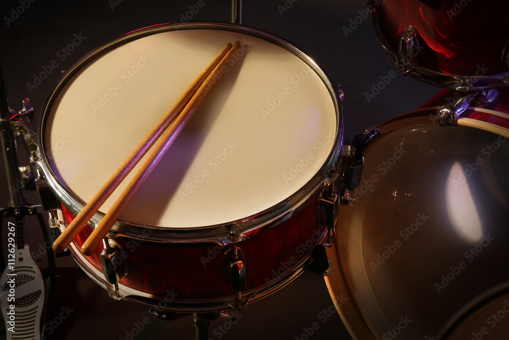 Drums set and sticks, close-up Drums set and sticks, close-up