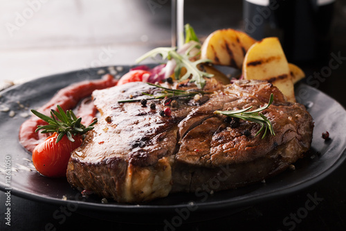 Grilled meat T-Bone with vegetables, spices