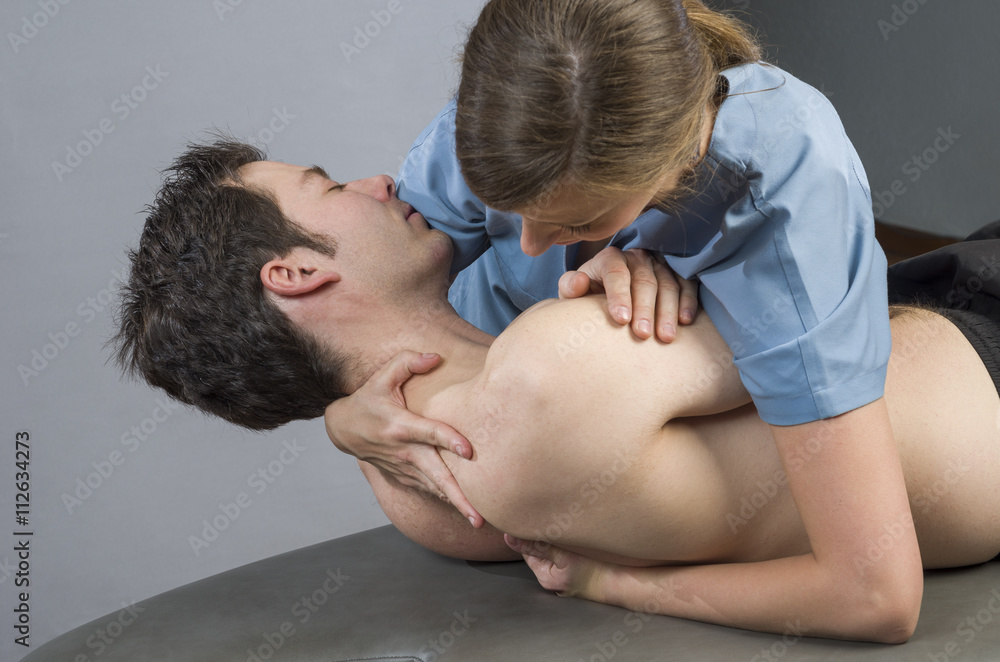 Fototapeta premium Pysioteraphty doing manipulation to man patient. Osteopathy.