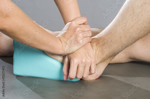 Chiropractor /physioterapist doing a feet massage © sunlight19