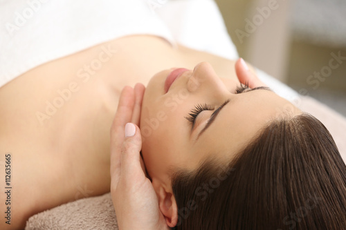 Young woman having massage ...