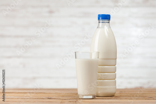 Milk bottle on wooden table