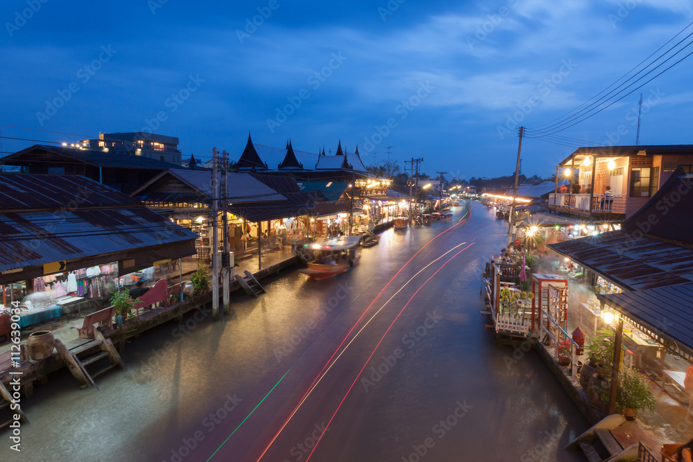 Floating market at night in Amphawa, Samut Songkhram , Thailand.