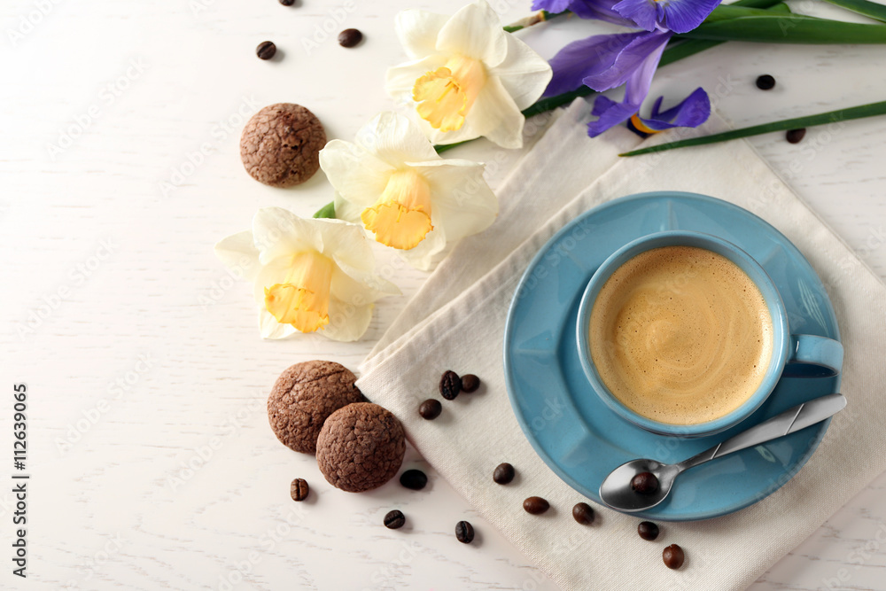 Cup of coffee with cookies and flowers on wooden table Cup of coffee with cookies and flowers on wooden table