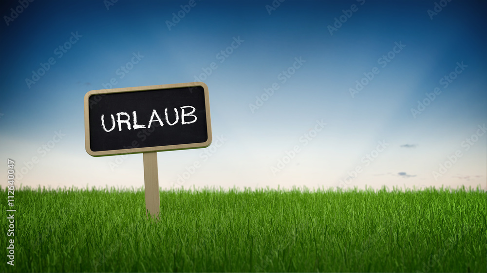 German sign - Urlaub (Vacation) - in a green field