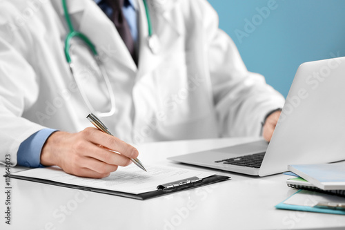 Doctor working on a compute...