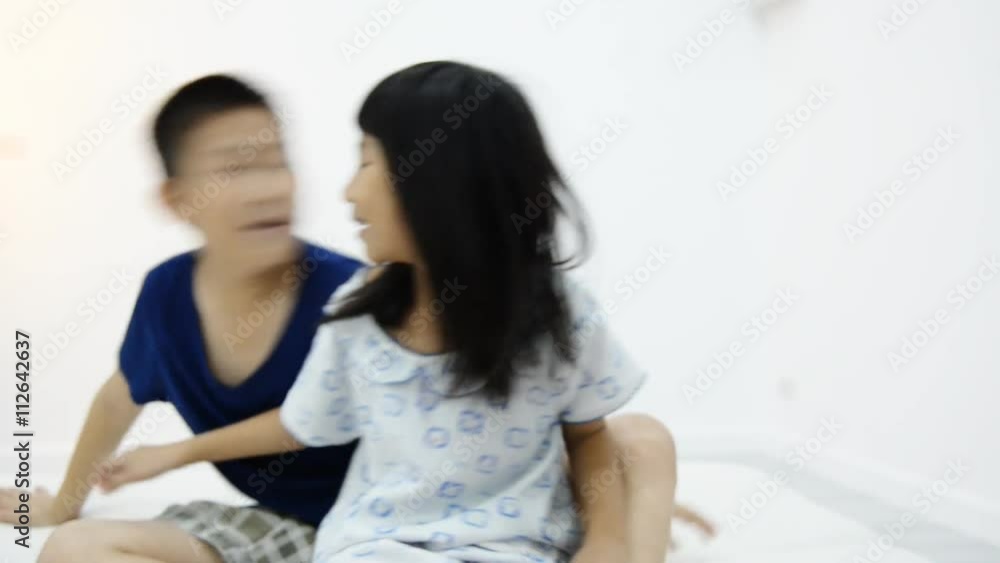 Happy Asian children playing together at home Happy Asian children playing together at home