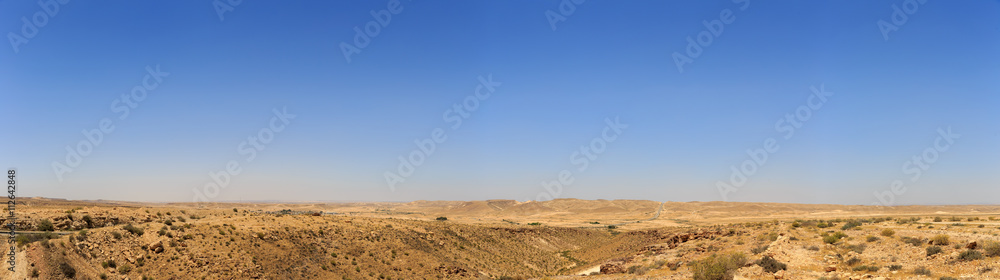 Big panorama of mountains in Negev desert with road