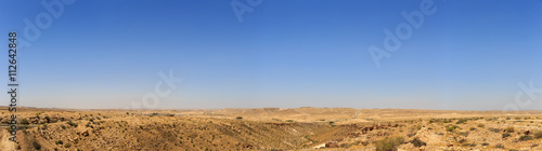 Big panorama of mountains in Negev desert with road