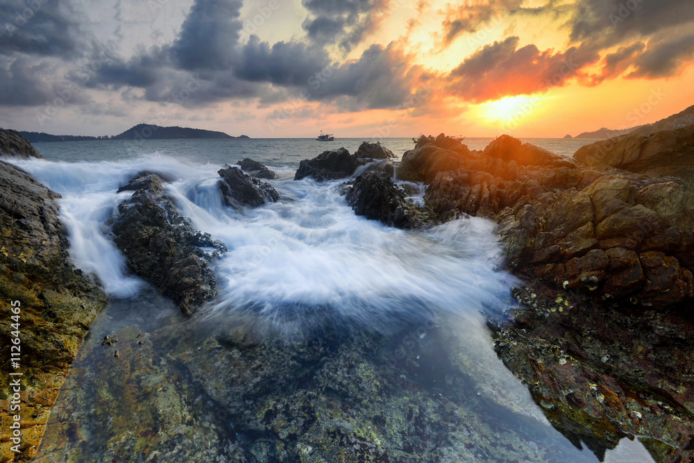 Amazing seascape during sunset with slow shutter technique  at Kalim Beach, Phuket Thailand.