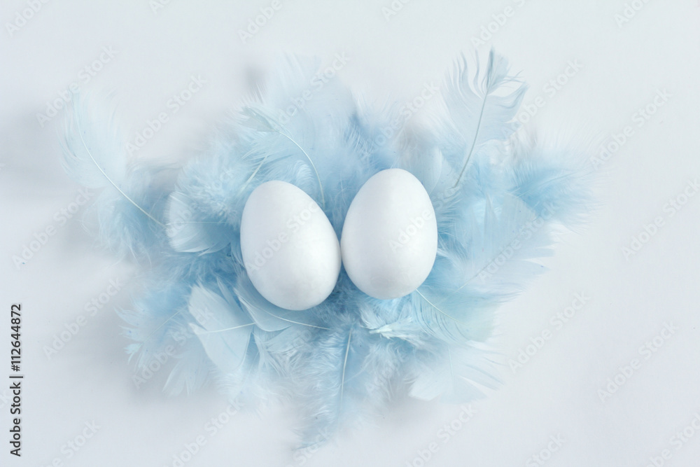 easter eggs. blue feathers, flat lay easter eggs. blue feathers, flat lay
