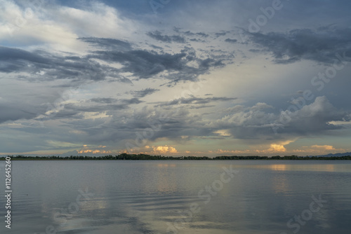 Fototapeta Naklejka Na Ścianę i Meble -  stormy evening sky over  lake