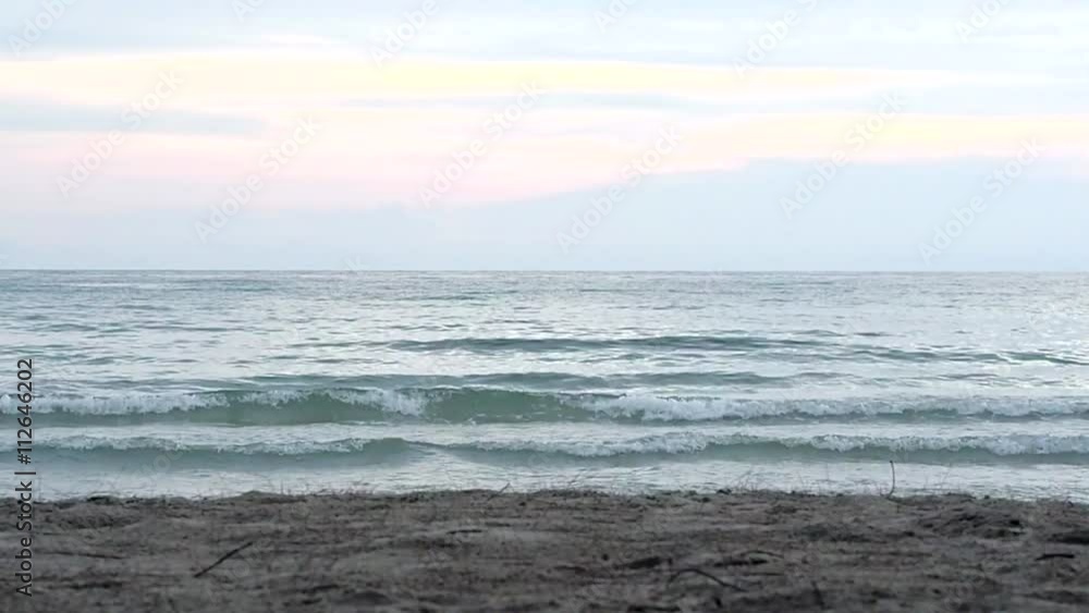 Afternoon beach and tidal waves, ground level view, with sand and real sound Afternoon beach and tidal waves, ground level view, with sand and real sound