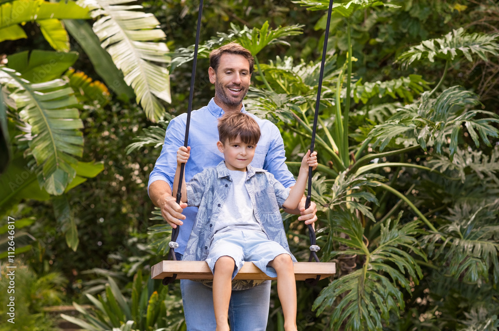 Father swinging son Father swinging son