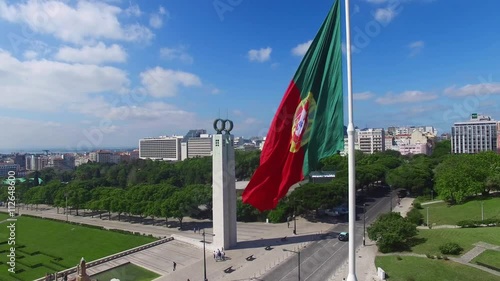 Portuguese Waving Flag in Eduardo VII Park in Lisbon, Portugal aerial view photo