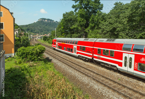 Red train is on the track in Saxony