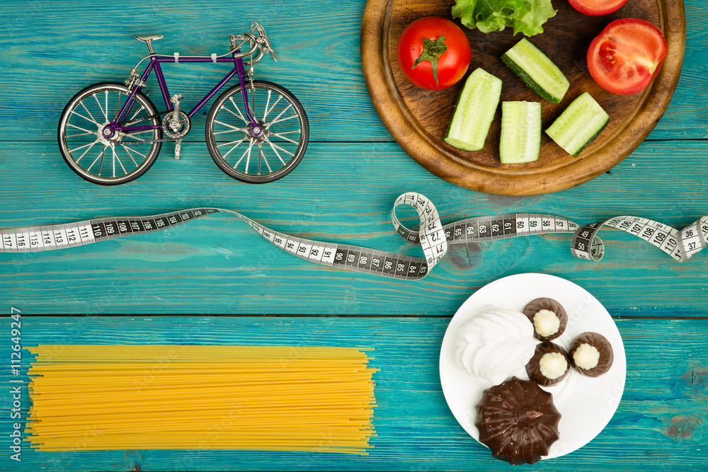 Choice of food: diet, vegetables and sports or cake, candy Choice of food: diet, vegetables and sports or cake, candy