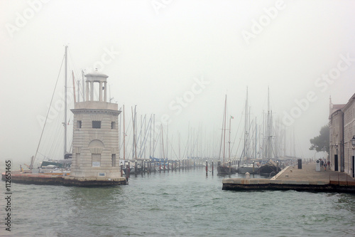 view from sea water on the old italian venetian boat dock with b