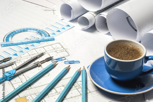 Workplace of architect - Architect rolls and plans. architectural plan,technical project drawing. Engineering tools view from the top. Construction background.