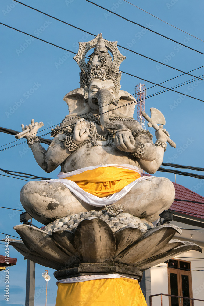 Massive statue of Ganesh in small city in Bali with electrical w
