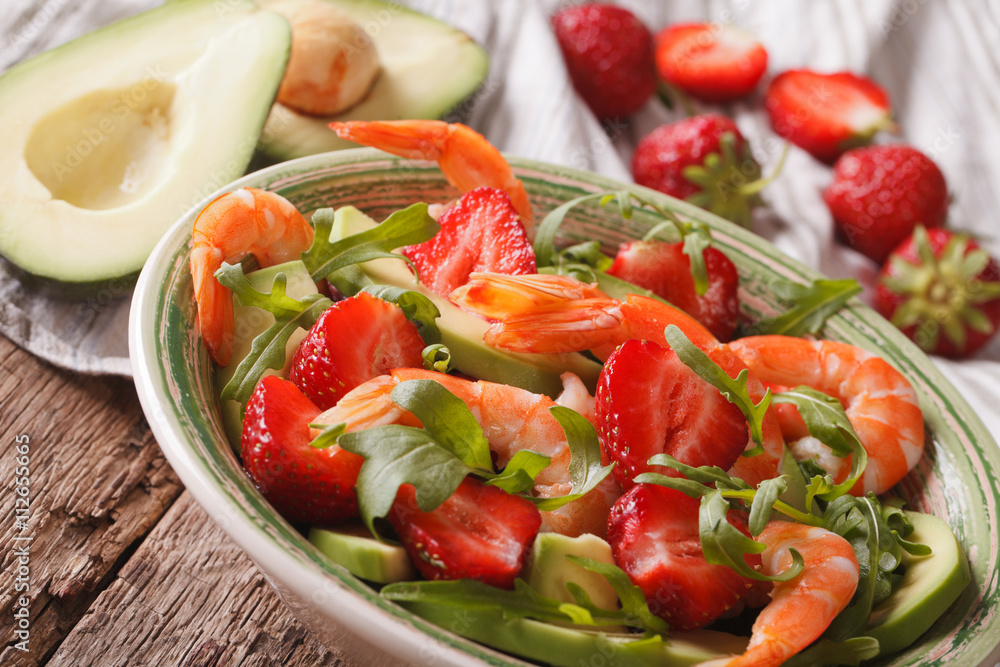 salad with strawberries, avocado, shrimp and arugula close-up. horizontal
salad with strawberries, avocado, shrimp and arugula close-up. horizontal