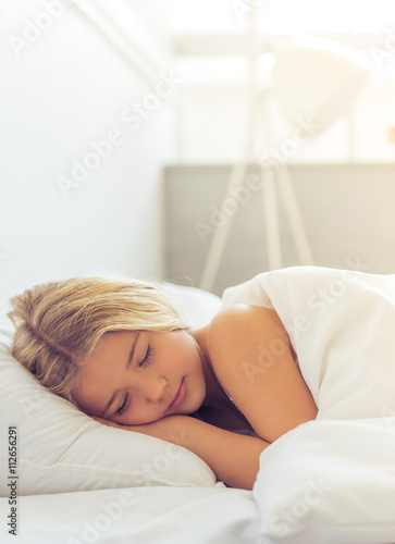 Cute little girl in bed