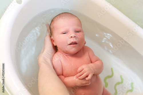 10 days newborn baby girl in bath