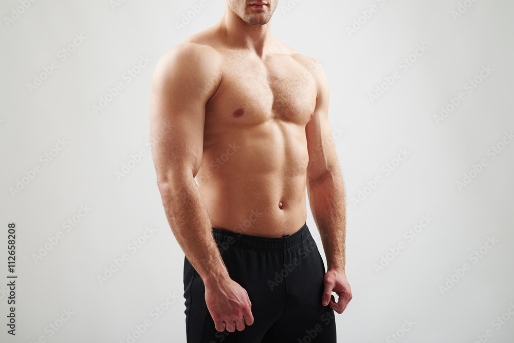 Fototapeta premium Muscular bare torso of athletic guy