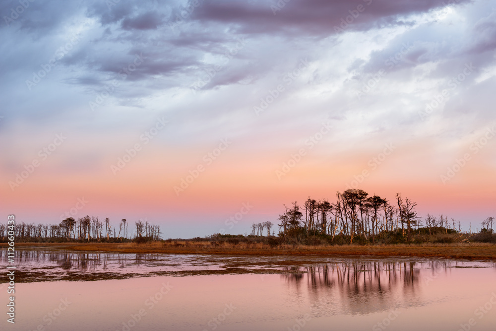 Fototapeta premium Dramatic Sky Along Coastal Inlet at Sunset