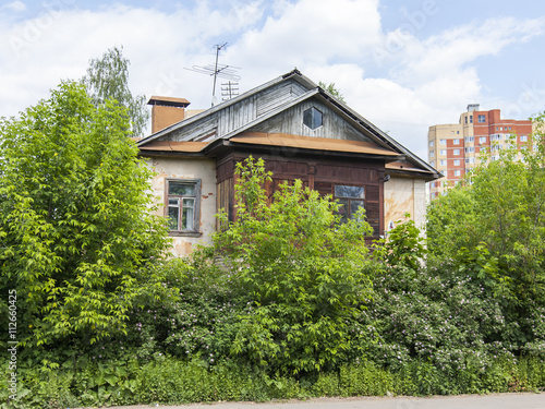 PUSHKINO, RUSSIA, on May 30, 2016. A fragment of a facade of one of shabby wooden houses in the central part of the city photo